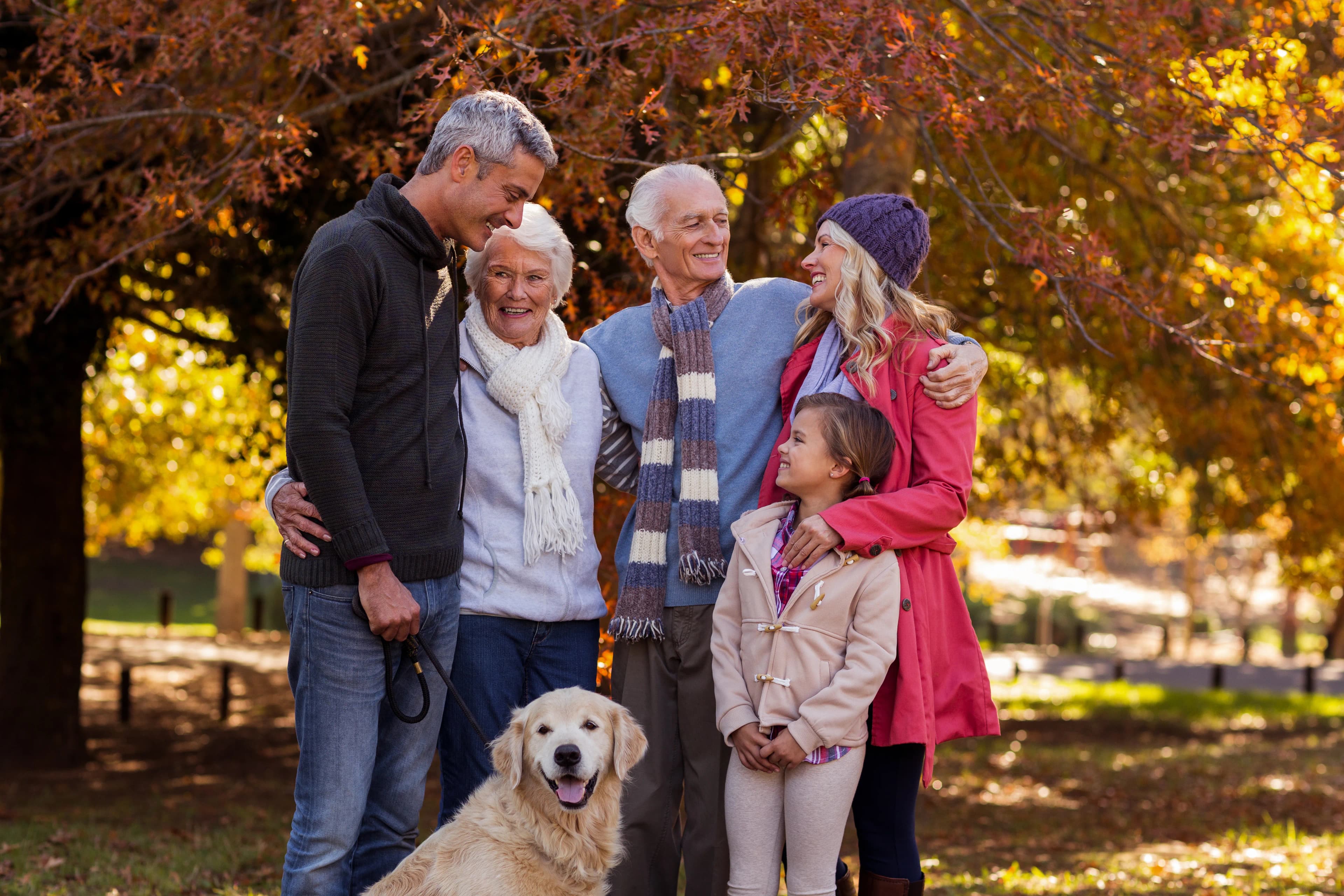 Family spending time together with their dog outdoors
