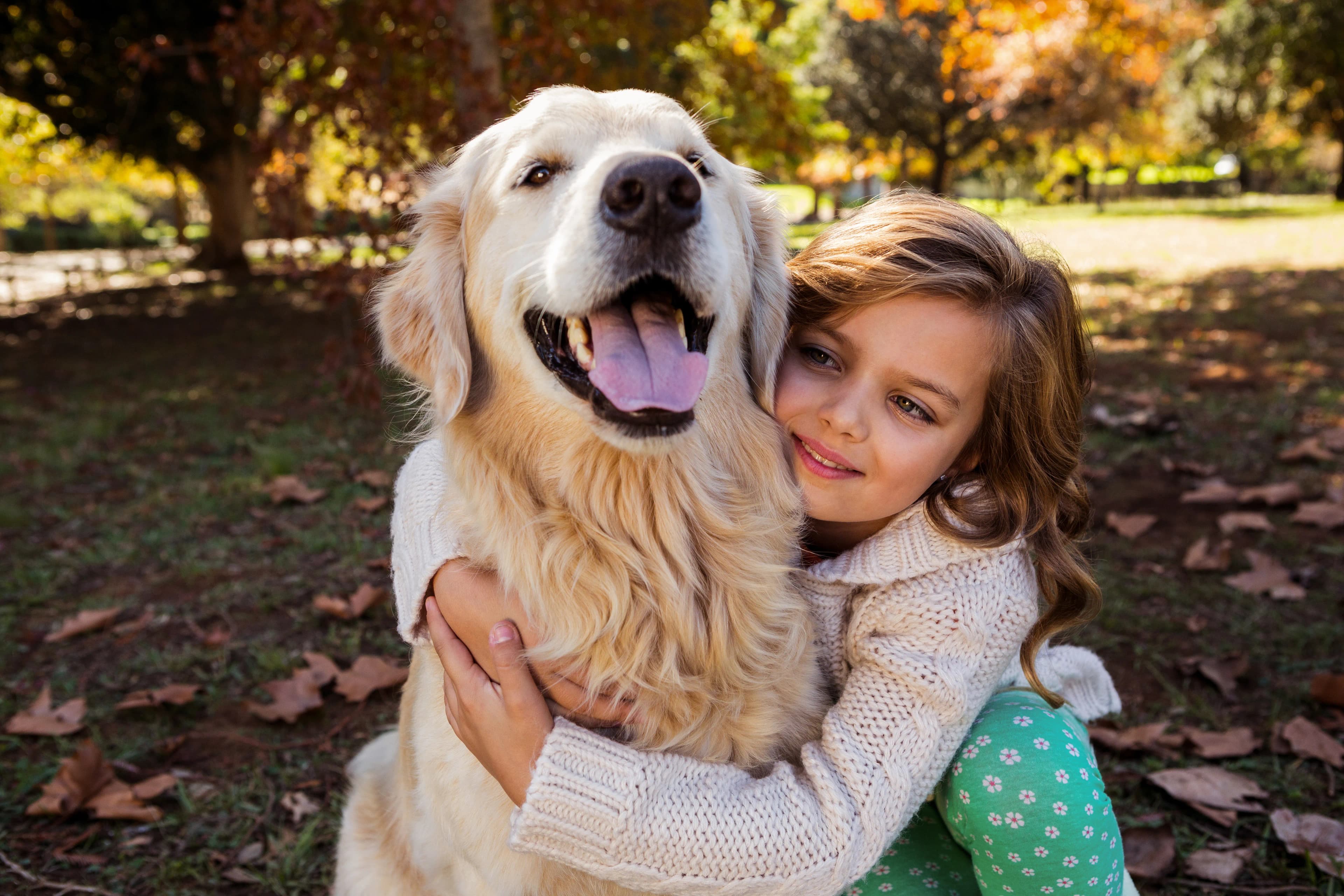 Family sharing a close moment with their dog