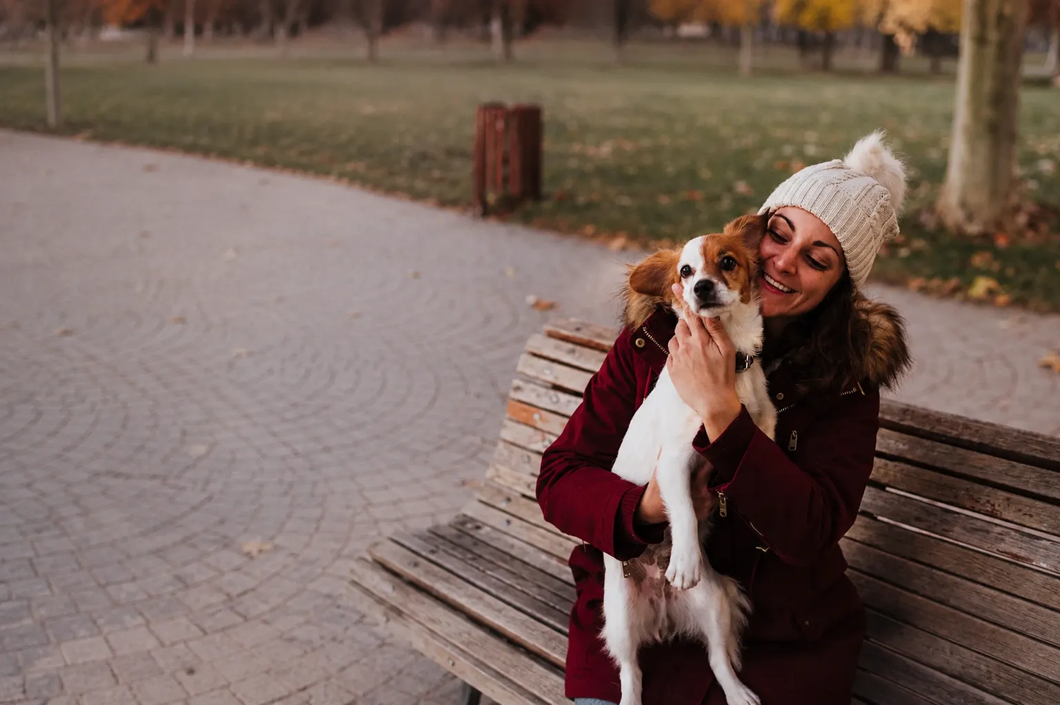 Woman sharing a warm moment with her dog during a Signature Story session